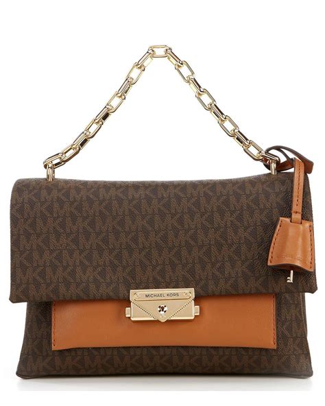 brown michael kors purse with irang strap|Michael Kors small brown purse.